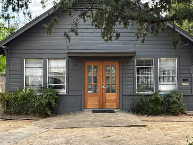 Clubhouse exterior with wood double doors