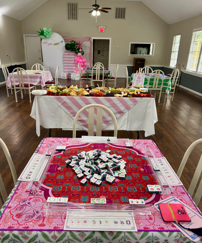 Mahjong table set up for a themed party with festive decor
